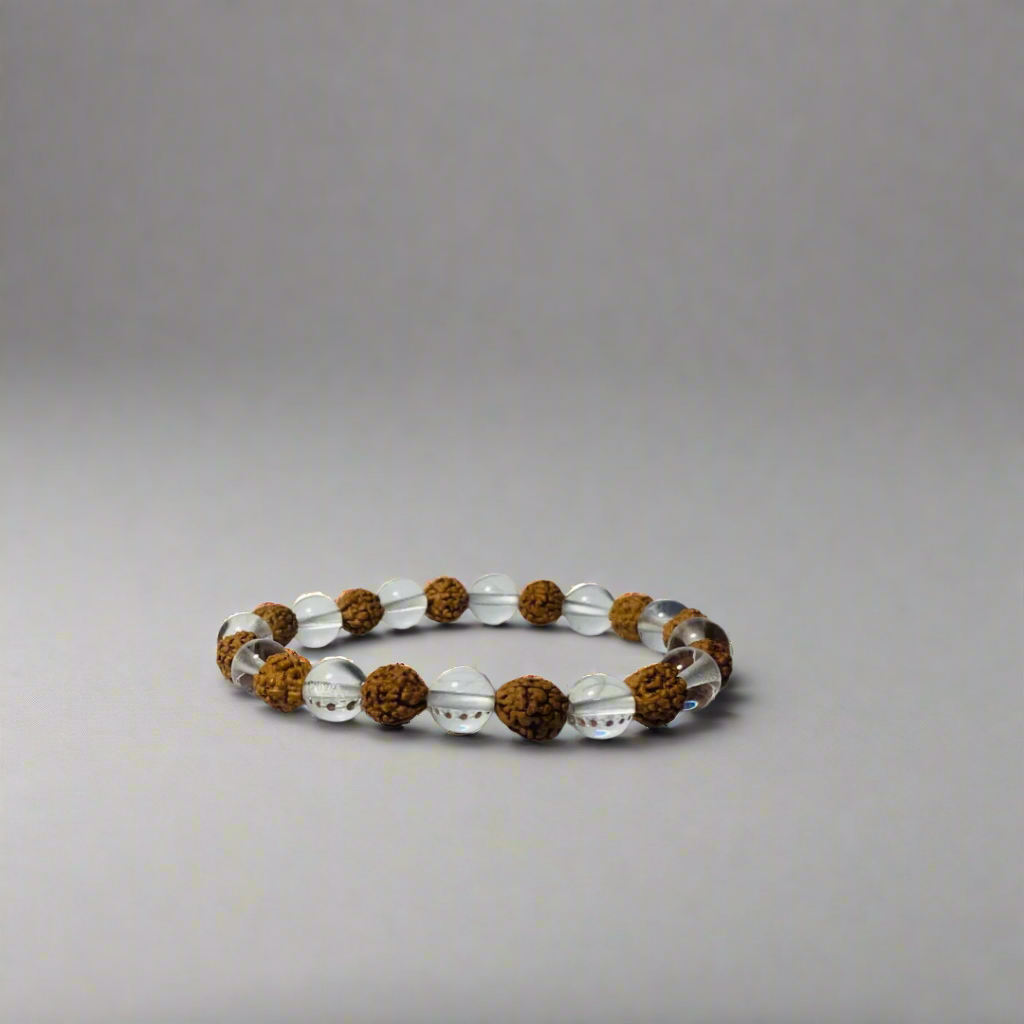 Bracelet with sphatik and rudraksha on a light gray background