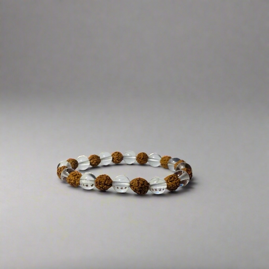 Bracelet with sphatik and rudraksha on a light gray background